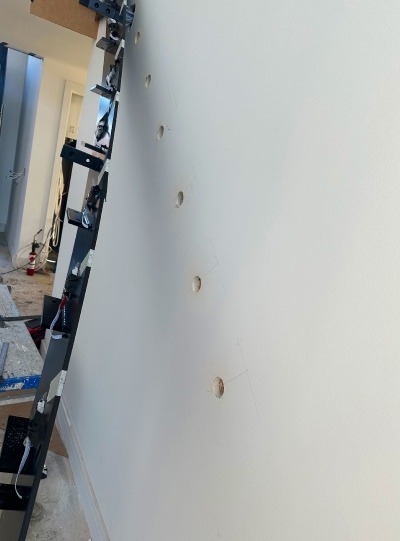 Stage 3 of the Installation Process: Offering the Metal Up to the Wall Stage 3 of the Installation Process: Offering the Metal Up to the Wall